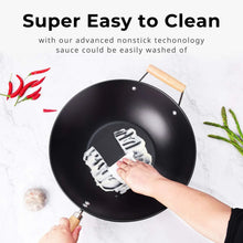 Black nonstick wok with wooden handle and hand cleaning tool