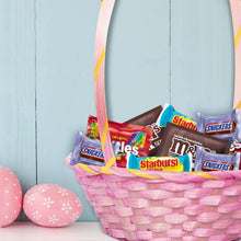 Easter basket filled with wrapped candies: Snickers, Starburst, M&M's, Skittles