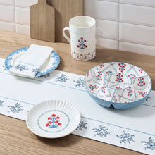 Blue-and-white floral ceramic plate with patterned rim, round dinner plate style