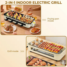 Electric indoor grill with grilling surface and removable plates for indoor cooking