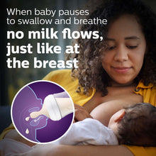 Philips Avent baby bottle held by caregiver during feeding, white and blue