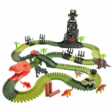 Assembled dinosaur track set with green rails, crane tower, and multiple dinosaur figures