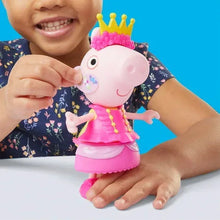 Small Peppa Pig doll wearing a pink crown and dress, held by a child