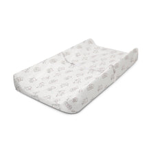 Contoured changing pad with white plush cover, contoured surface, and bear print