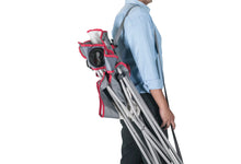 Folded oversized quad chair with red straps and gray frame carrying bundle