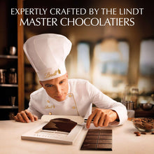 Chef wearing a Lindt hat preparing Lindt dark chocolate bars on a work table