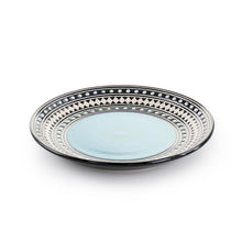 Blue sage stoneware dinner plate with light blue center and patterned white rim on black base