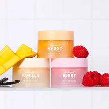 NatureWell lip mask jars for Mango, Vanilla, and Berry with fruit accents.
