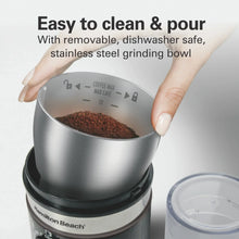 Stainless steel grinding bowl with removable lid on an electric coffee grinder