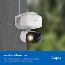 Wall-mounted outdoor security camera in white housing with two front camera lenses