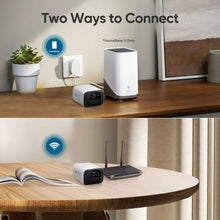 eufy SoloCam C210 wireless outdoor camera with indoor hub on a wooden table