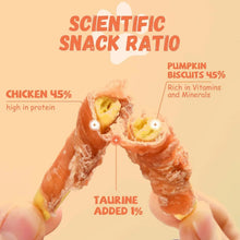 Chicken jerky wrapped pumpkin biscuit dog treats with visible filling, hand-held cut pieces.