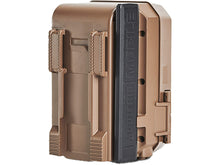 Tan trail camera side close-up with hinged cover and textured grip