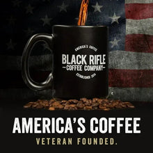 Black Rifle Coffee Company logo mug with coffee grounds and beans