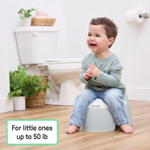 Grey toddler training potty with rounded seat and child seated on top
