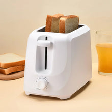 White 2-slice toaster with two toasted bread slices in slots
