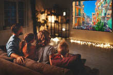 Projector screen playing an outdoor city scene for a couch viewing setup