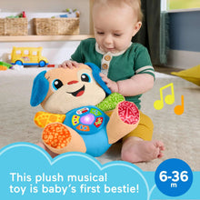 Plush musical puppy toy with light-up buttons, held by a baby
