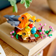 LEGO Bird's Nest 40639 bird nest set close-up with orange birds, eggs, and pink flowers
