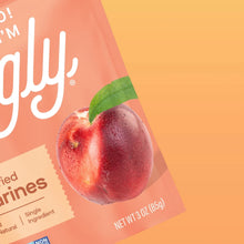 Close-up of sliced dried nectarines snack bag corner with pictured nectarines and green leaf