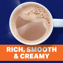 Cup of creamy decaf coffee with tan foam, close-up