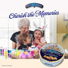 Royal Dansk cookie tin on a birthday table with a woman and child wearing bunny ears