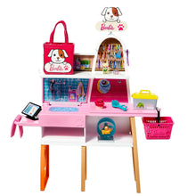 Barbie pet boutique playset with pink grooming counter, pet carrier, and tools