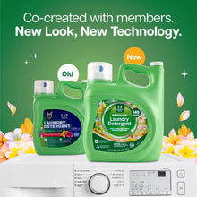 Green Member's Mark laundry detergent jug with a handle, shown beside the older bottle