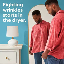 People loading laundry into the dryer; fighting wrinkles claim