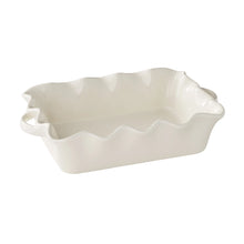 White ceramic baking dish with wavy scalloped rim