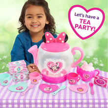 Minnie Mouse play tea set teapot with heart medallion, cups, plates, and spoon