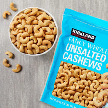 Fancy whole unsalted cashews with bowl and Kirkland Signature bag