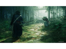 PS5 game screenshot of samurai figures on a misty forest path