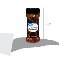 Crushed red pepper jar with black lid shown with height measurement