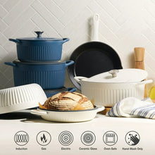 White enameled cast iron skillet with lid and side handles
