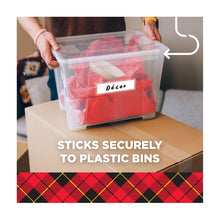 Clear packing tape strip securing a plastic storage bin lid