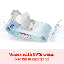 Baby wipes pack with flip-top open and wipe coming out, 99% pure water