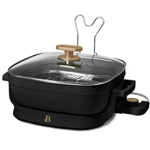 Electric skillet with glass lid and perforated steam rack, black base