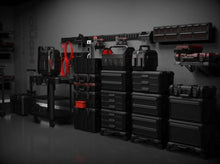 Garage tool wall with multiple black tool pouch organizers for storage