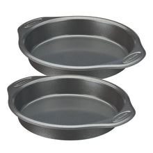 Two gray nonstick oval pans with rounded rims and helper handles