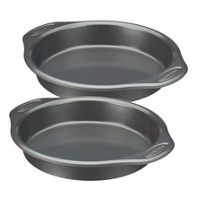 Pair of gray nonstick oval pans with flat rims and embossed marks