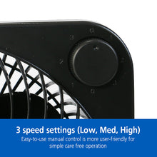 Black table fan with speed control dial near the front grille
