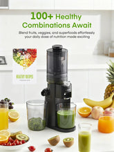 Black cold press juicer machine with top feed chute and juice cup on countertop.