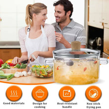 Glass cooking pot with lid and two side handles, cork knob, on countertop