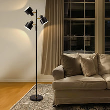 Black tall 3-light floor lamp with adjustable shades and round weighted base