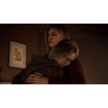 PS5 game scene of two characters embracing indoors, one holding the other from behind.