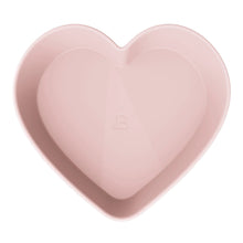 Pink heart-shaped stoneware baking dish, smooth interior with centered stamp