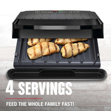 George Foreman grill and panini maker open with grilled food on plates