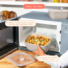 Taupe stoneware bake dish with lid, being placed in microwave