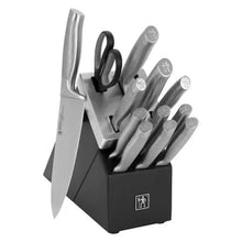Self-sharpening knife block with gray knives and kitchen shears in slots